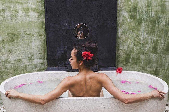 jacuzzi bathtub with woman bathing