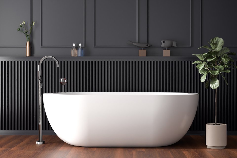 white freestanding soaking tub with tub filler